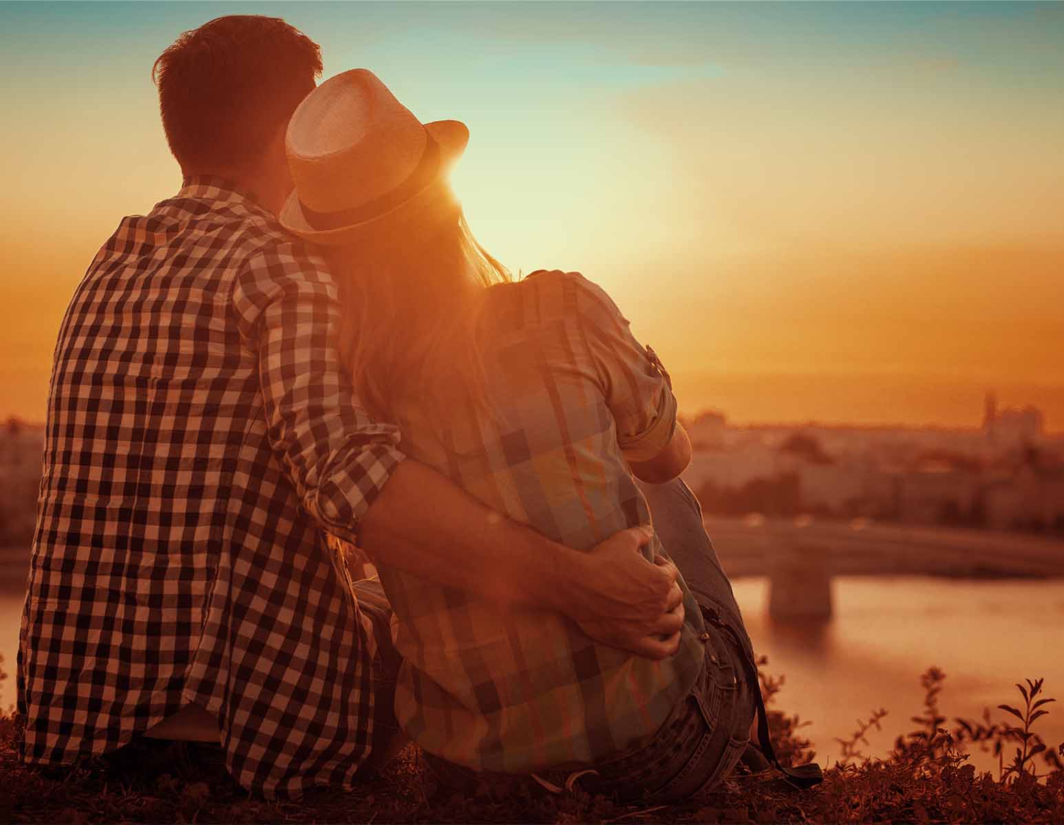 Man and woman observing sunset