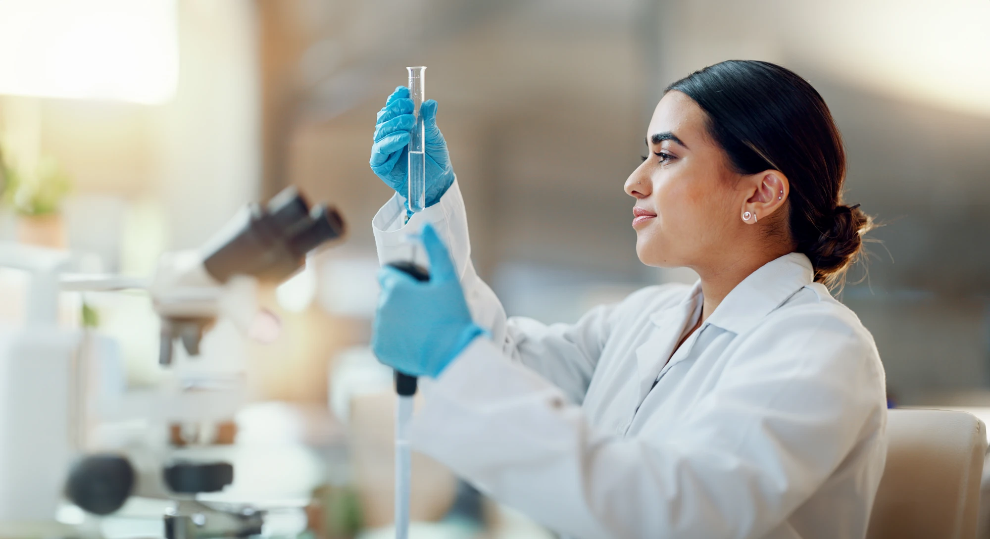 Lab technician labeling a urine sample cup for an HEB pre-employment drug test.
