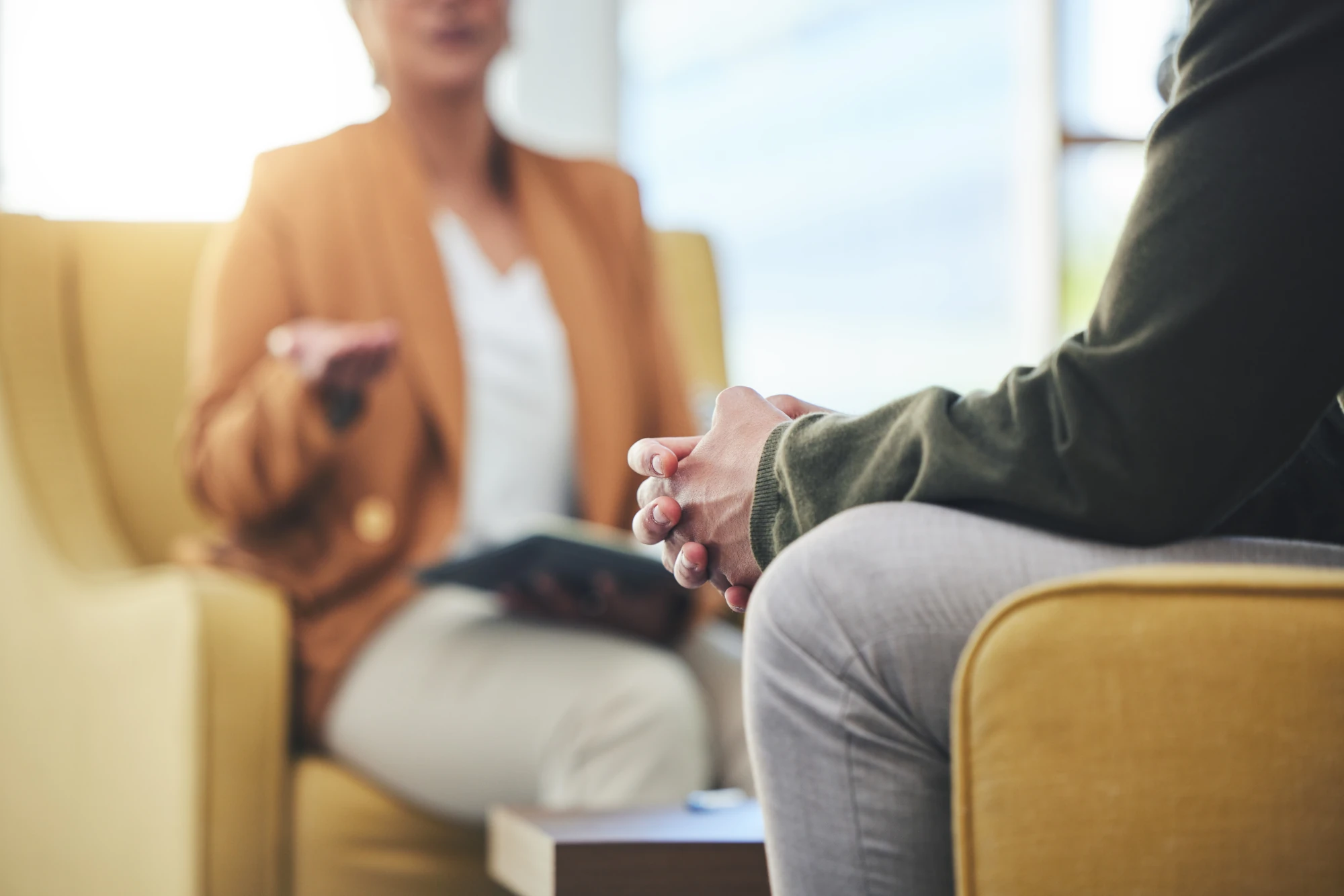 Counselor meeting with a client during drug and alcohol rehab for HEB employees.
